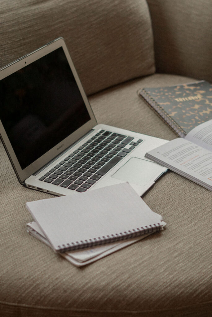 Laptop and notepad on desk